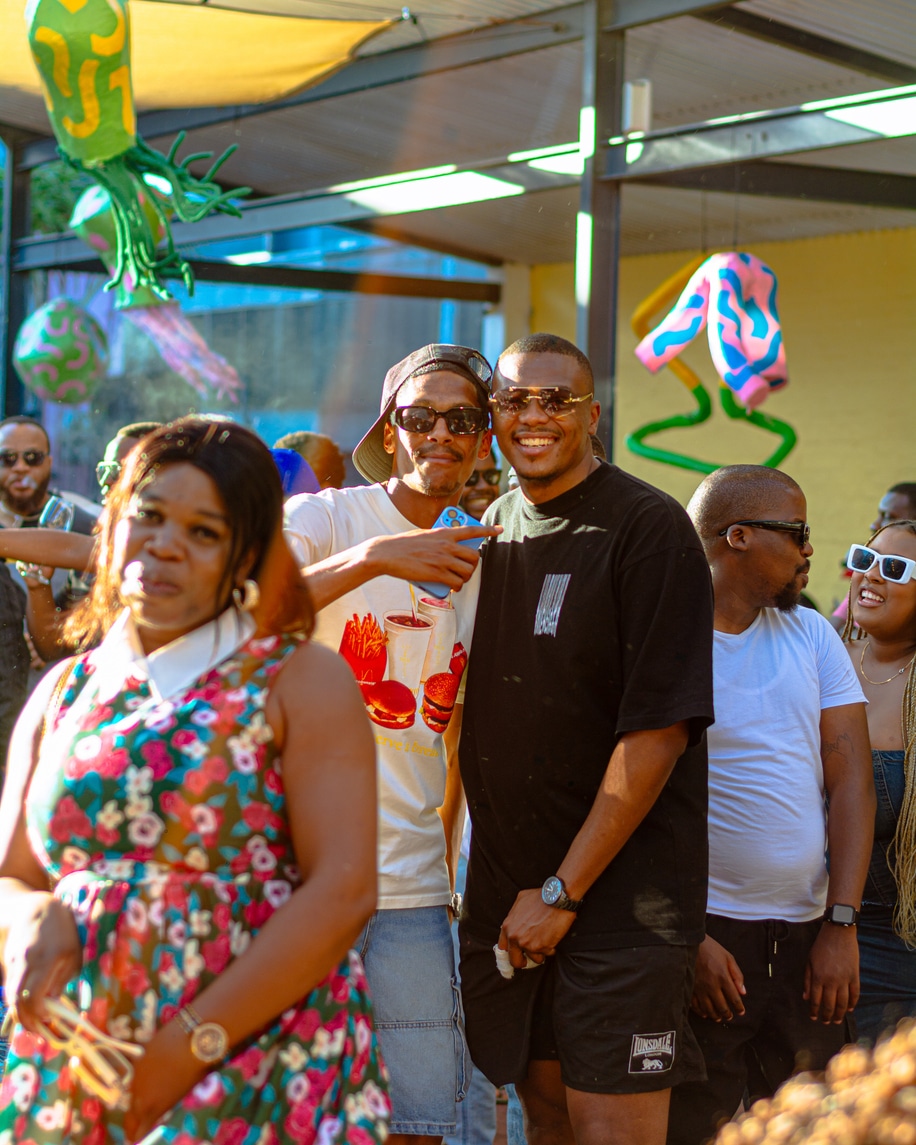 Lively atmosphere at the Old Biscuit Mill in Cape Town, South Africa, featuring visitors exploring stalls, local food, and artisan crafts. A vibrant scene of community, culture, and lifestyle.