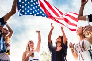 Friends celebrating US Independence Day outdoor.