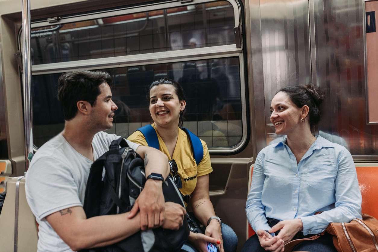 Friends chatting inside the subway in New York