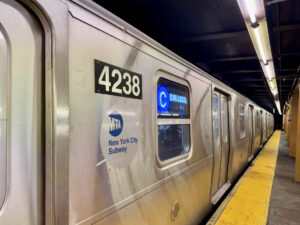 New York, NY USA - December 17, 2024 : New R211 C train (8th Avenue local) with MTA New York City Subway logo entering the 145th Street subway station in Harlem, Manhattan, New York City
